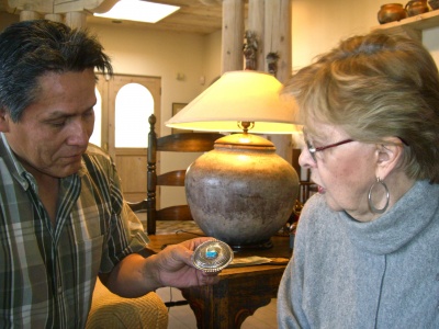 ron_bedonie_showing_marti_struever_his_silver_and_turquoise_buckle_400