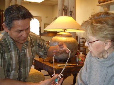 ron_bedonie_showing_marti_struever_his_silver_and_turquoise_necklace_400