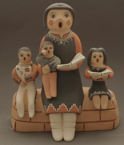 Linda Lucero Fragua Storyteller on Wall With Three Children